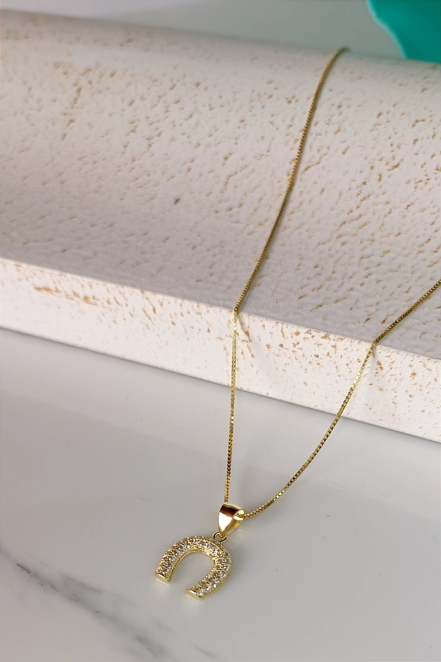 Horseshoe bombe' necklace in gold plated 925 silver and pavé workmanship.