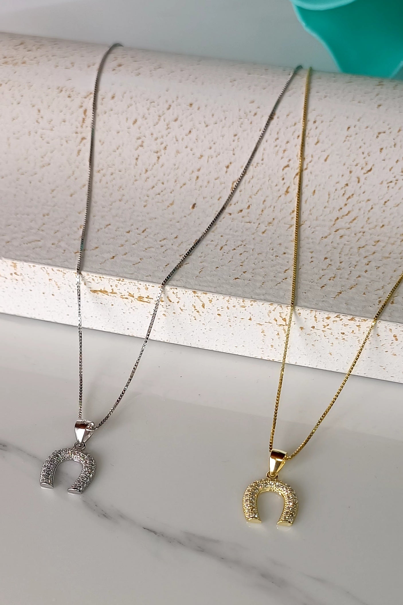 Horseshoe bombe' necklace in gold plated 925 silver and pavé workmanship.